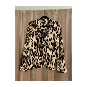 Animal print blouse with one tie at neck.